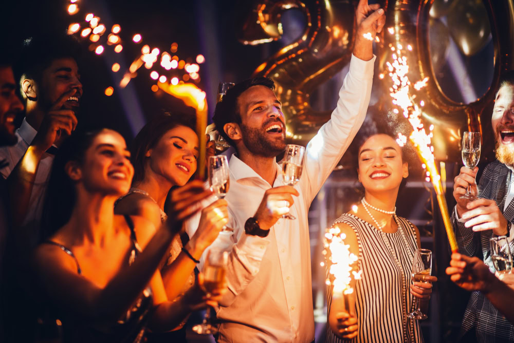 A group of friends celebrating New Year’s indoors in Phuket 