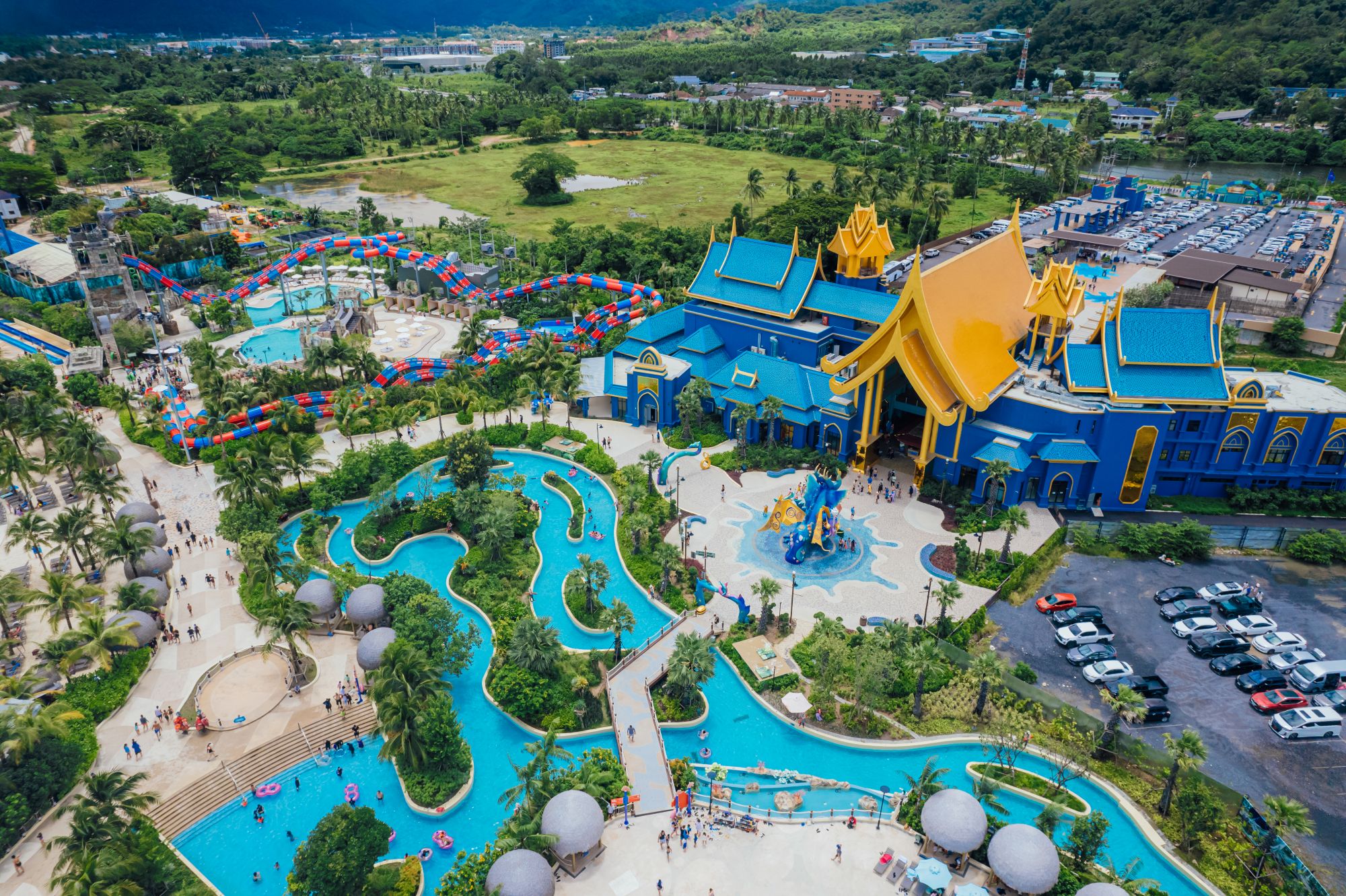 Father and daughter riding down a waterslide