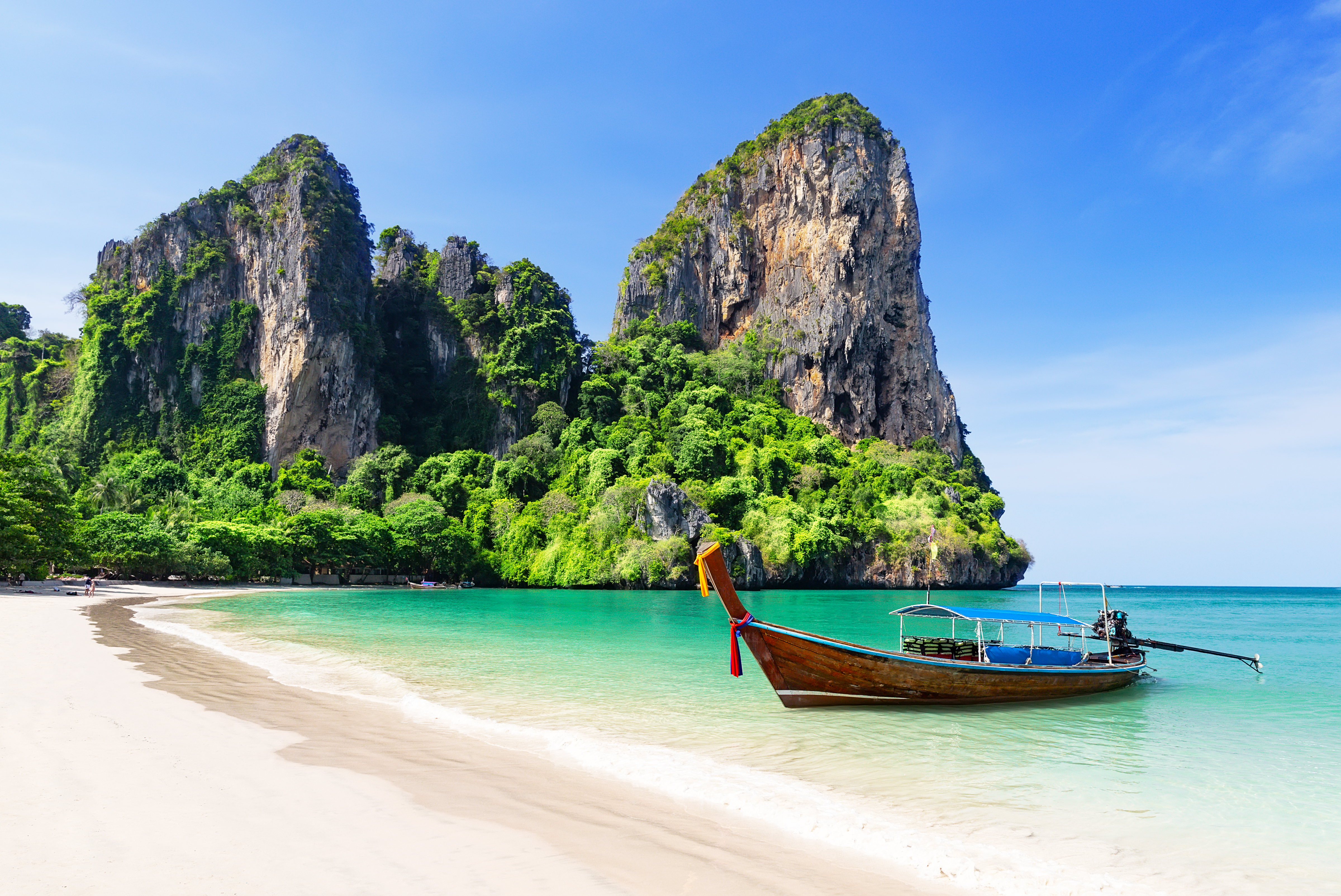 island hopping with long tail boat a famous tourist attraction in thailand